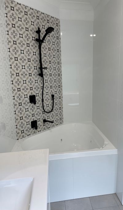 bathroom renovation- a bathtub with a shower head