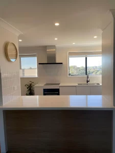 kitchen renovations- a kitchen with a white countertop and a white sink