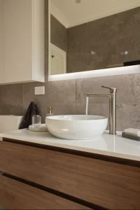 bathroom renovation-a sink with a faucet and a mirror