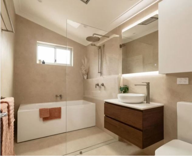 bathroom renovations near me- a bathroom with a sink and a shower