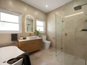 Bathroom-Renovations-a bathroom with a glass shower and sink