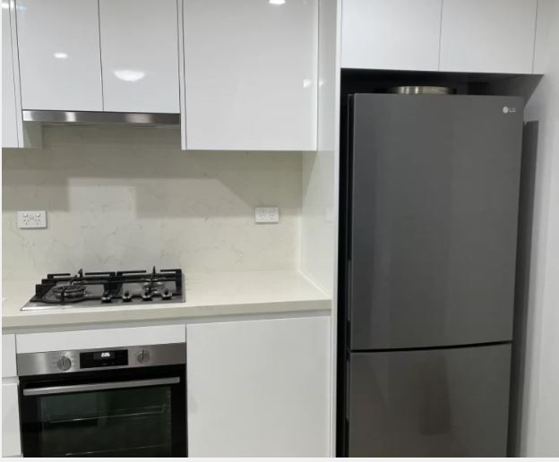 kitchen renovations near me- a kitchen with a refrigerator and stove
